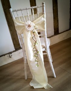 chair sash with rose