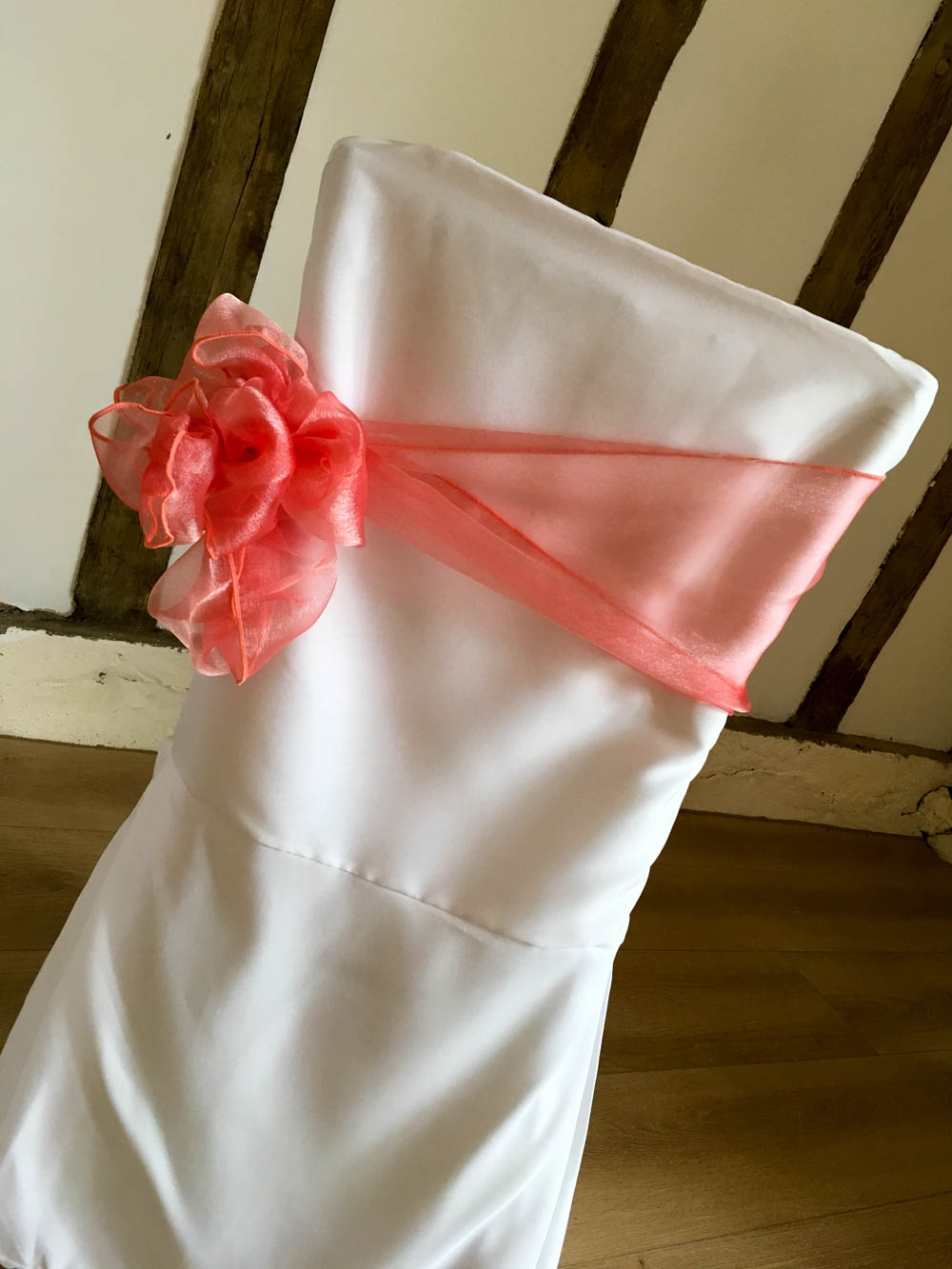 chair cover with coral side bow